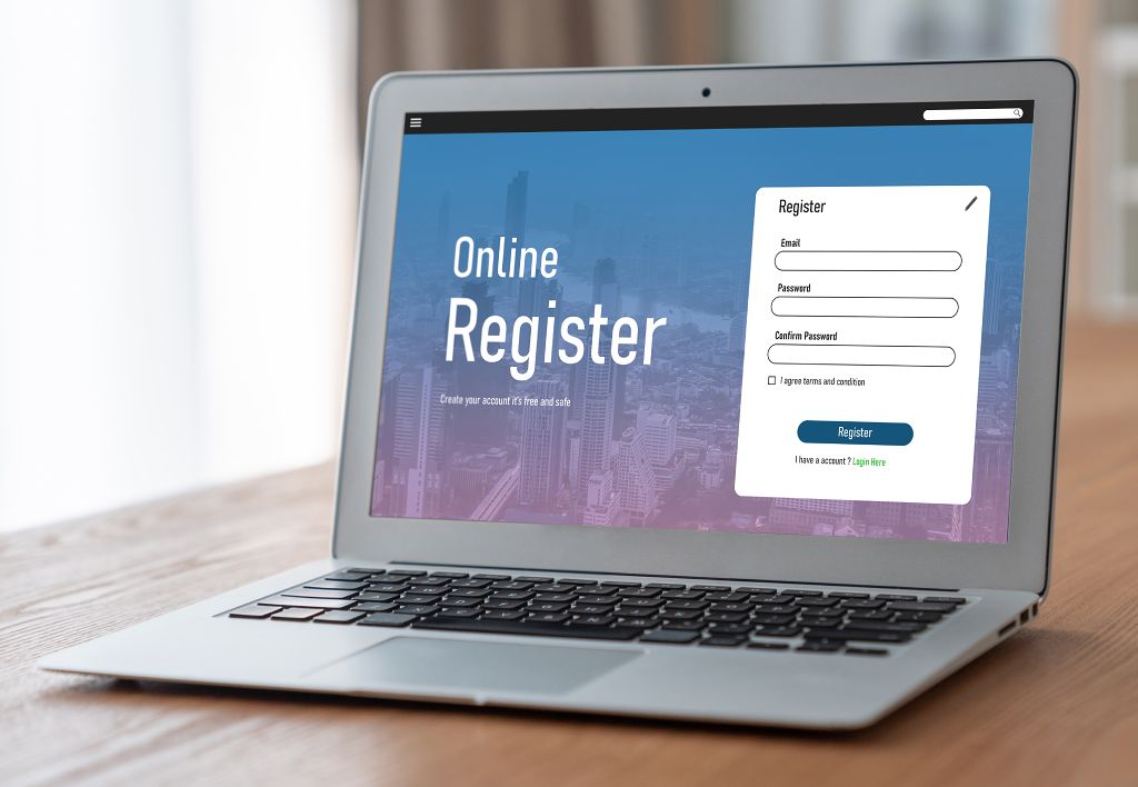 Membership laptop on table with online registration form shown on screen